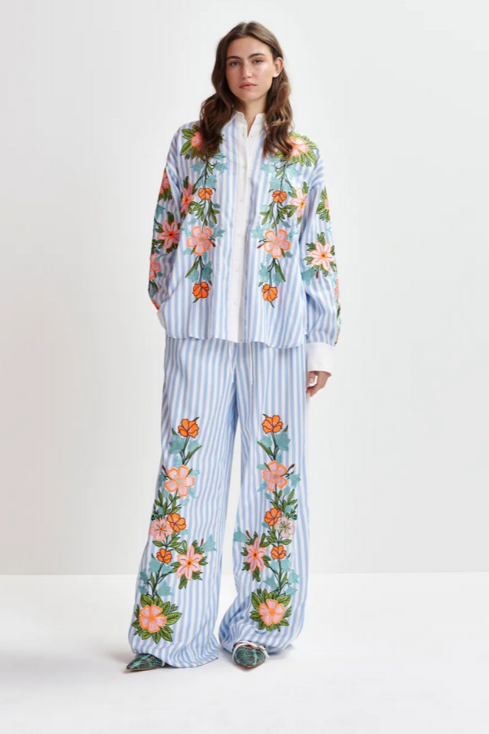 Blue, white and multicolored wide-leg pants with contrast border and embroideries