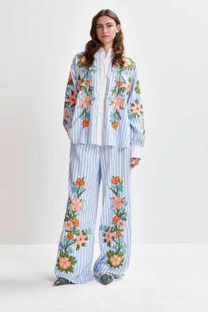 Blue, white and multicolored wide-leg pants with contrast border and embroideries