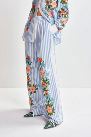 Blue, white and multicolored wide-leg pants with contrast border and embroideries