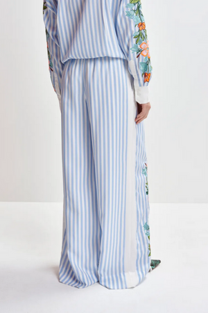 Blue, white and multicolored wide-leg pants with contrast border and embroideries
